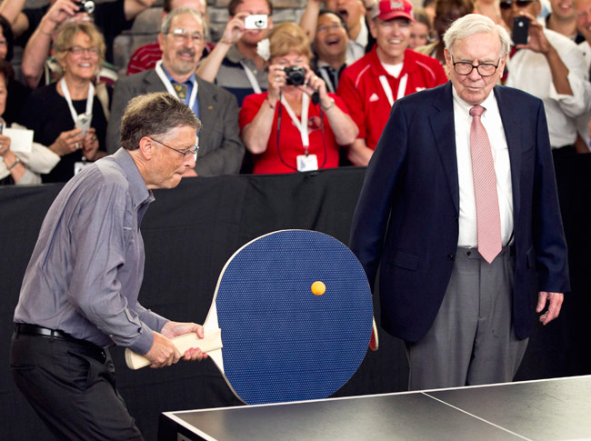 Warren Buffet with a huge paddle