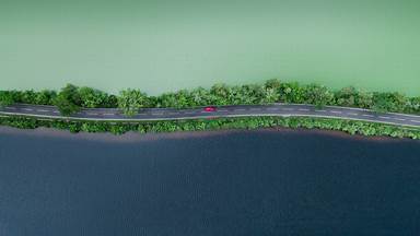 Aerial view of a road separating two lakes in the Scottish Highlands (© Abstract Aerial Art/Getty Images)