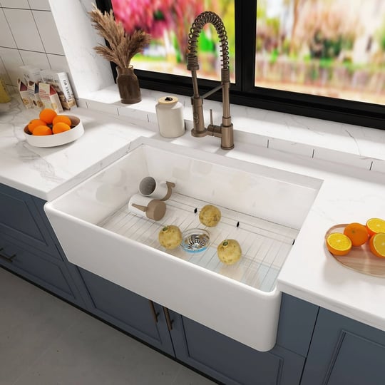 white-fireclay-33-in-single-bowl-farmhouse-apron-kitchen-sink-with-sink-grid-1