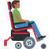 Man in motorized wheelchair facing right: medium-dark skin tone