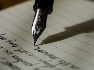 Person writing with fountain pen