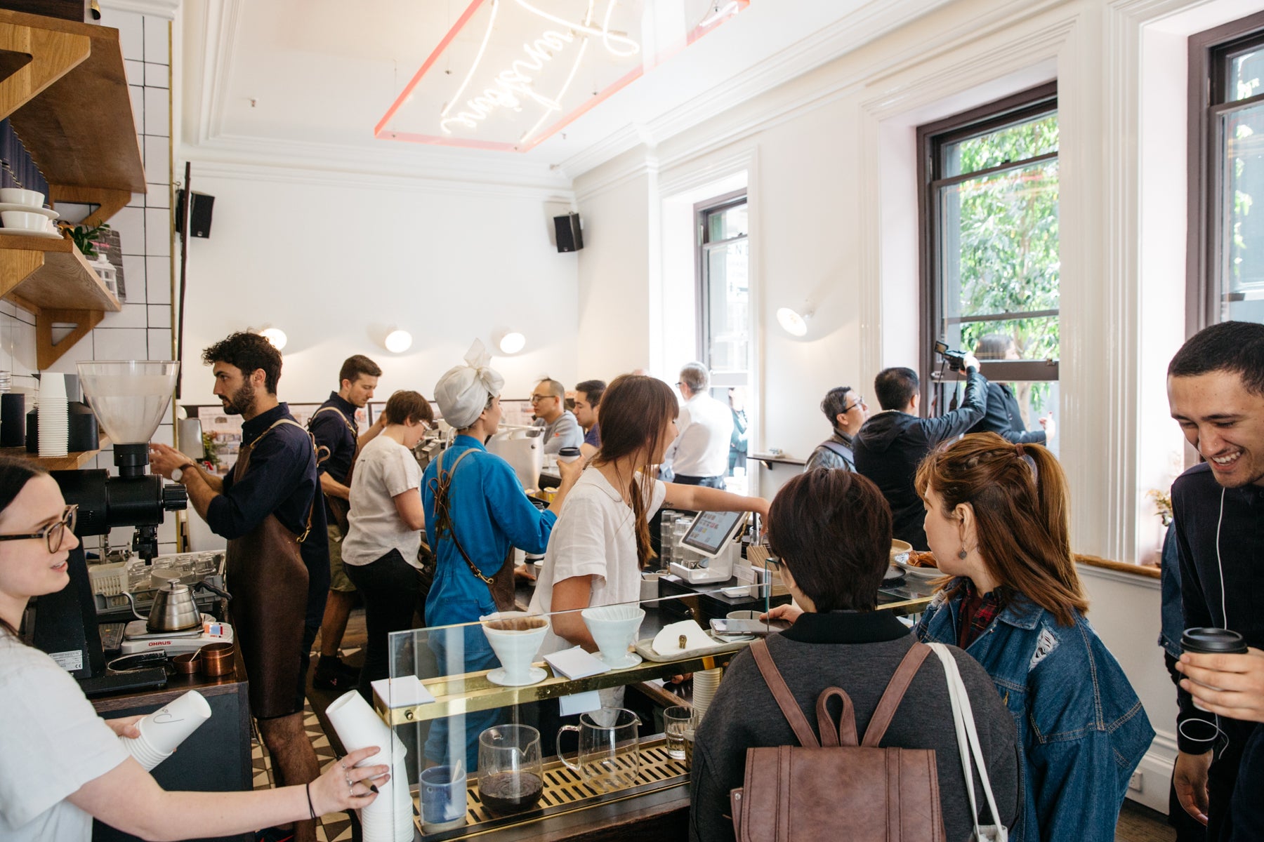 A view inside Patricia cafe full of people enjoying coffees