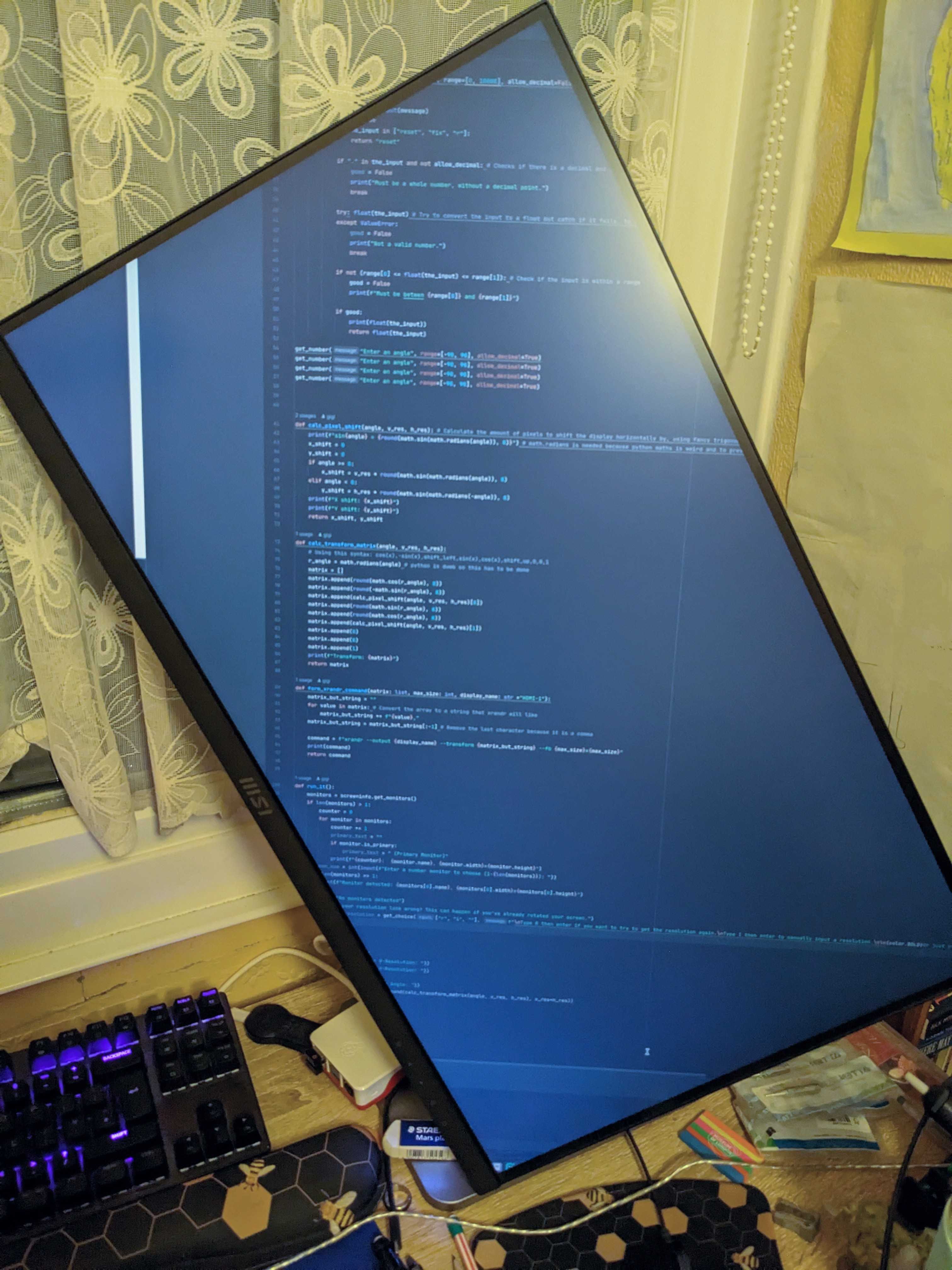 A picture of a monitor rotated to fit the most lines of code from corner to corner