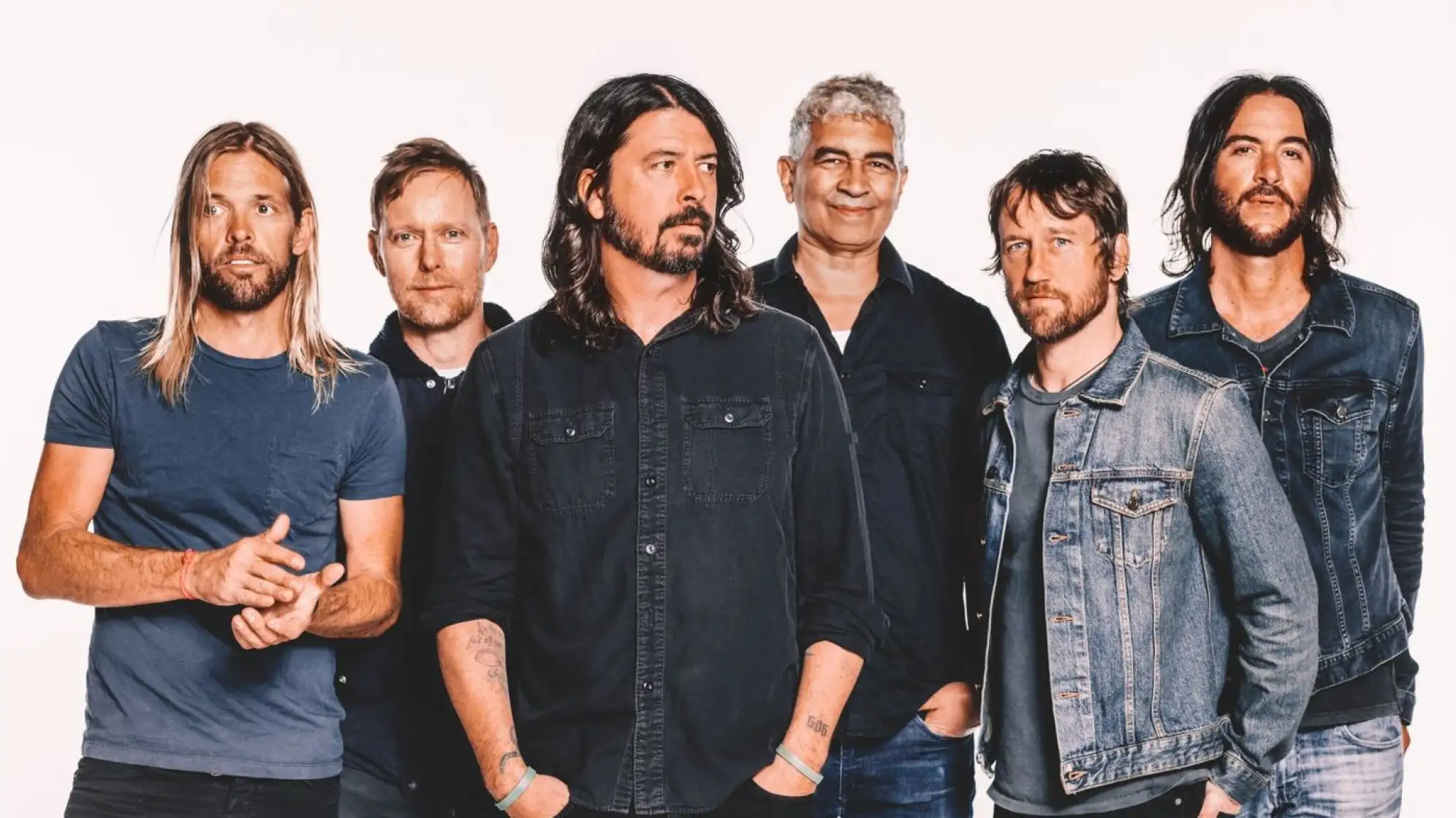 A photo of the Foo Fighters (rock band) against a white background