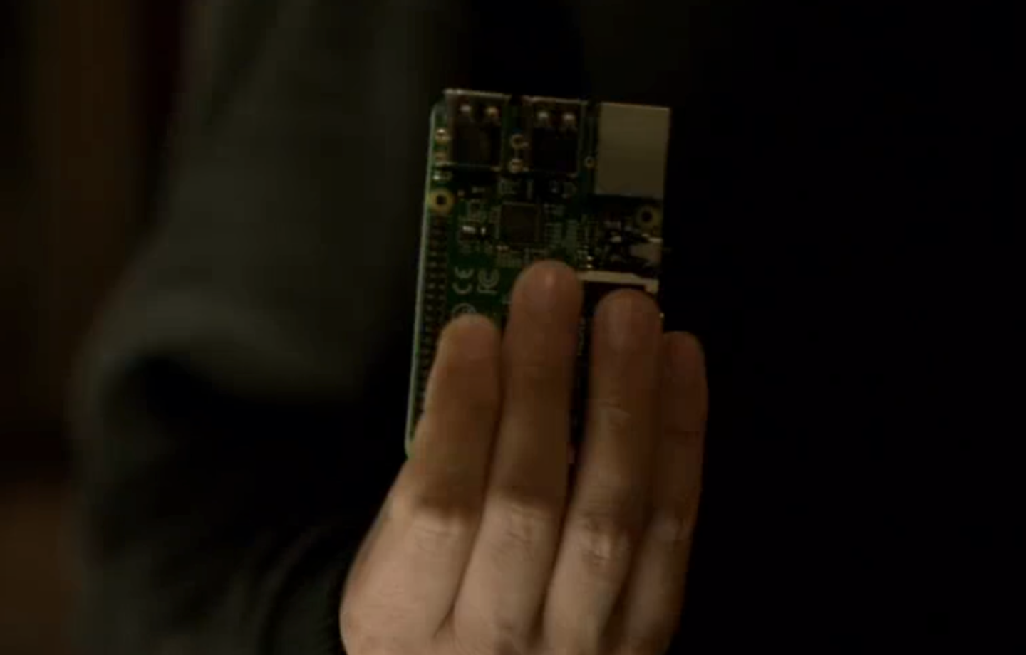 Elliot holds up a Raspberry Pi, :robot: screenshot 📷